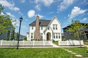 A white house with a white picket fence.