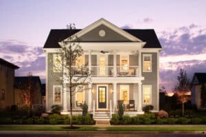 A home with a front porch at dusk.
