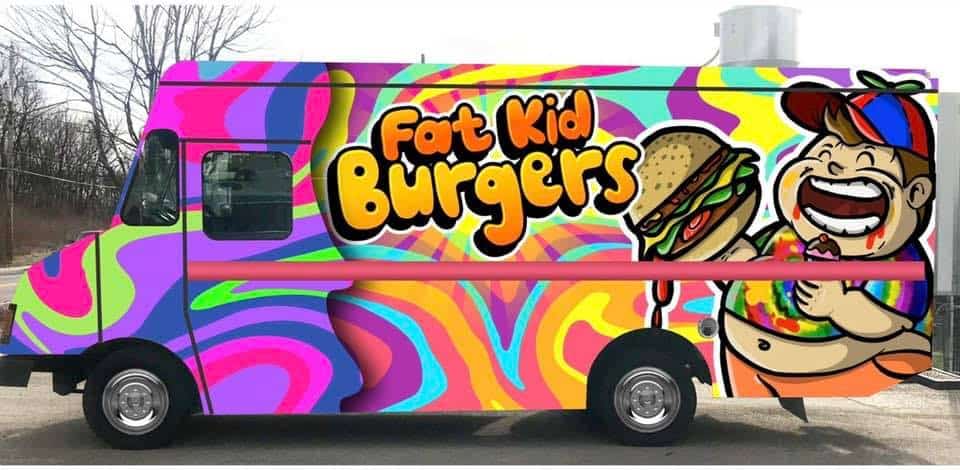 A brightly colored food truck with psychedelic swirls and "Fat Kid Burgers" branding, featuring a cartoon of a joyful child holding a large burger.