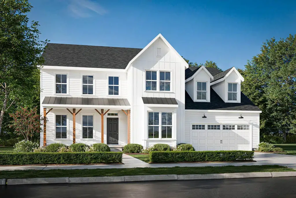 A two-story white farmhouse with black shingled roofs, a covered front porch with wood posts, and an attached two-car garage sits against a blue sky with green trees—an inviting opportunity to explore homeownership in Lewis Center.
